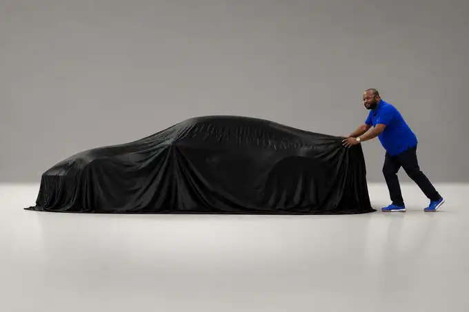 Vehicle reveal at delivery